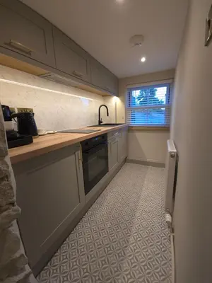 a kitchen with a sink and a dishwasher at Modern Retreat near Aberaeron - Luxe 1 bed Escape in Ciliau-Aeron
