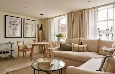 a living room with a couch and a table at Market View - The Georgian House in Ludlow