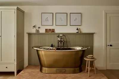 a bath tub in a room with a sink at Stretton Hills Peaks - The Georgian House in Ludlow