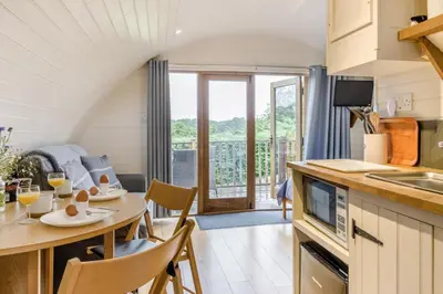 a kitchen and dining room with a table and chairs at 1 Bed in Garth oc-h32701 in Garth