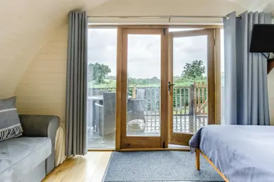 a bedroom with a bed and a sliding glass door at 1 Bed in Garth oc-h32701 in Garth