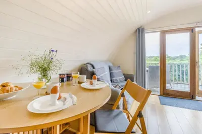 a dining room with a table and chairs with a view at 1 Bed in Garth oc-h32701 in Garth