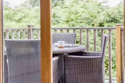 an outdoor table with a cup of coffee on it at 1 Bed in Garth oc-k32702 in Garth