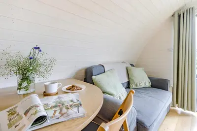 a living room with a table and a couch at 1 Bed in Garth oc-k32702 in Garth