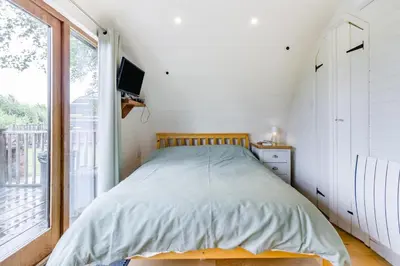 a bedroom with a bed and a large window at 1 Bed in Garth oc-k32702 in Garth