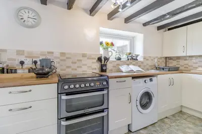 a kitchen with a stove and a dishwasher at 2 Bed in Llanon oc-e32781 in Llanon