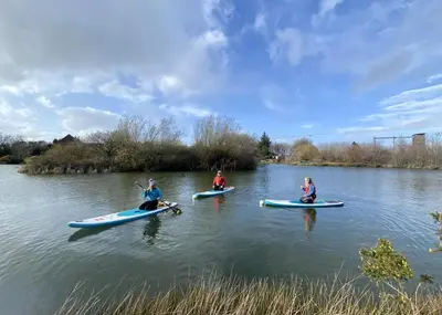 three people in kayaks on a river at 2 Bed in Llanon oc-e32781 in Llanon