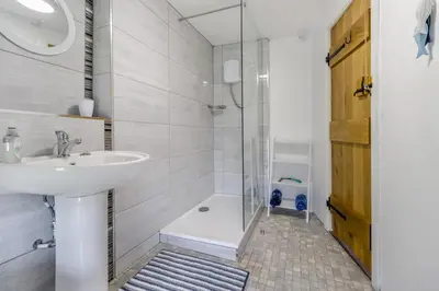 a bathroom with a shower and a sink and a shower at 2 Bed in Llanon oc-e32781 in Llanon