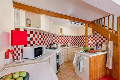 a kitchen with a red and white checkered wall at 2 Bed in Brecon oc-t32728 in Brecon