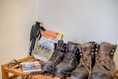 a pile of boots on a table next to a box at 2 Bed in Brecon oc-t32728 in Brecon