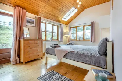 a bedroom with a bed and a wooden ceiling at 5 Bed in Devils Bridge oc-t13712 in Devils Bridge