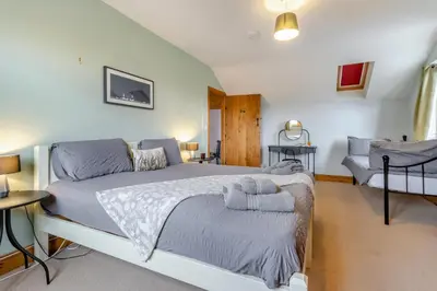 a bedroom with a large bed and a couch at 5 Bed in Devils Bridge oc-t13712 in Devils Bridge