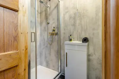 a bathroom with a shower with a toilet and a sink at 5 Bed in Devils Bridge oc-t13712 in Devils Bridge