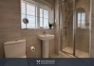 a bathroom with a toilet and a sink and a shower at 3 Bed Stylish Shrewsbury Home in Shrewsbury