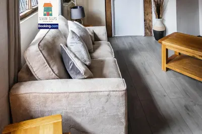 a living room with a couch and a table at Spacious 5 Family Rooms House By Shropshire Escapes Short Lets & Serviced Accommodation Shrewsbury With Free WiFi in Shrewsbury
