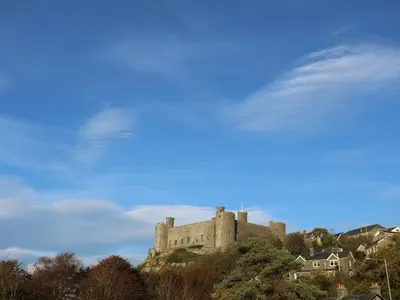 a castle sitting on top of a hill at Gold Caravan 203 in Talybont