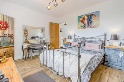 a bedroom with a bed and a desk and a sink at 3 Bed in Forden oc-c30173 in Forden