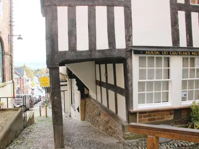 a building with a window and a sign on it at 41 High Street in Bishops Castle