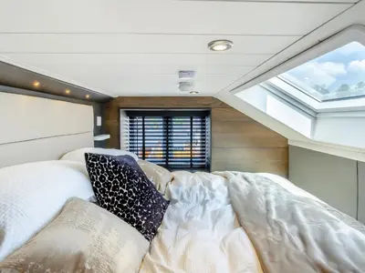 a room with a bed and a large window at Aqueduct Hideaway in Llangollen