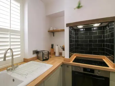a kitchen with a sink and a counter top at Raven Lane Retreat in Ludlow