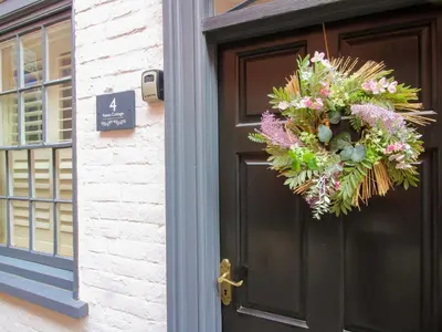 a wreath on the door of a house at Raven Lane Retreat in Ludlow