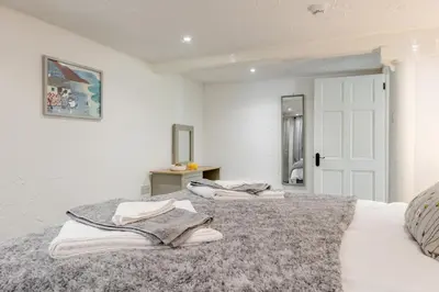 a bedroom with a bed with towels on it at 1 Bed in Capel Bangor oc-y33024 in Capel Bangor