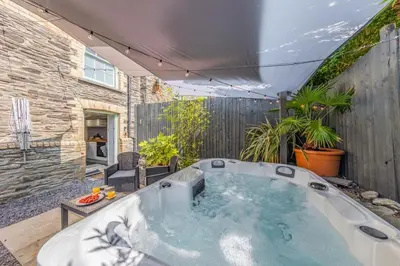 a hot tub in the backyard of a house at 1 Bed in Capel Bangor oc-y33024 in Capel Bangor