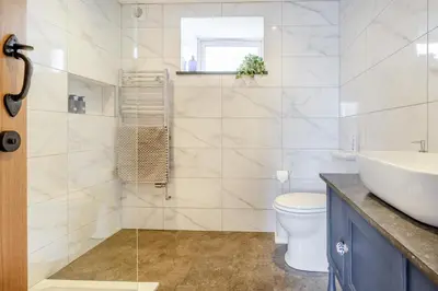 a bathroom with a sink and a toilet at 3 Bed in Tywyn oc-h32633 in Tywyn