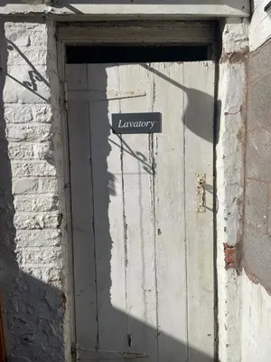 a door with a street sign on top of it at Victorian Town House Shrews in Shrewsbury