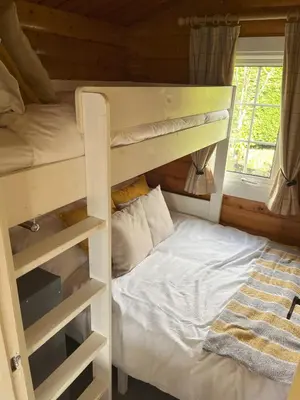 a bedroom with a bunk bed and a bunk bed at Log Cabin Retreat Snowdonia in Trawsfynydd