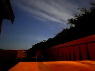 a view of the night sky from a balcony at Log Cabin Retreat Snowdonia in Trawsfynydd