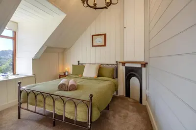a bedroom with a bed in a attic at 2 Bed in Islawrdref oc-w33317 in Penmaenpool