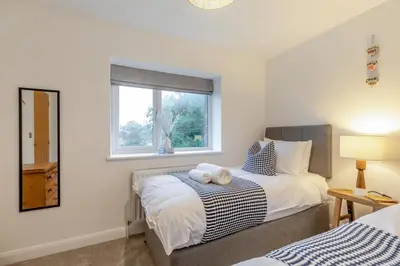 a bedroom with two beds and a window at 4 Bed in Llanigon oc-t33091 in Llanigon