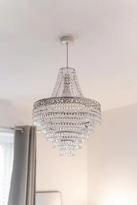 a chandelier hanging from a ceiling in a room at 2 Bedroom Apartment - Parking - Walk to Town in Shrewsbury