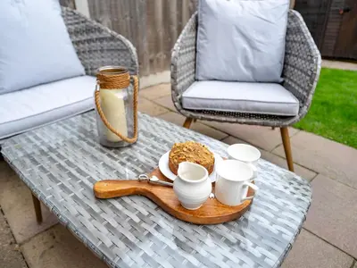 a table with cups and a tray of food on it at Pass the Keys Charming 2 Bed Townhouse Short Walk To The River in Shrewsbury