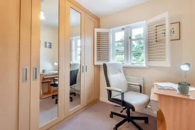 a home office with a white chair and a desk at 2 Bed in Weobley oc-c32945 in Weobley