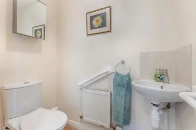 a white bathroom with a toilet and a sink at 2 Bed in Weobley oc-c32945 in Weobley