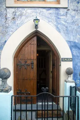 an entrance to a building with a wooden door at Salem The Blue Chapel in Llwyngwril