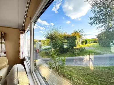 a window view of a yard from a caravan at Hafren View in Machynlleth