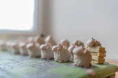 a group of small figurines sitting on a table at Cefn-Isaf in Llanbedr