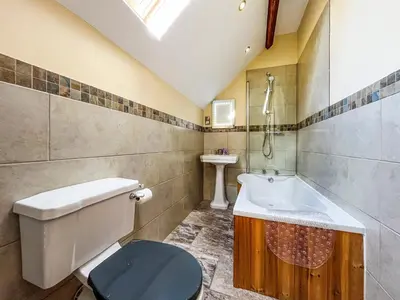 a bathroom with a toilet and a sink at The Dairy -Uk50616 in Corwen