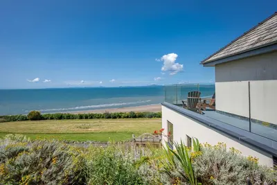 a view of the ocean from the balcony of a house at Sarn-Badrig in Harlech