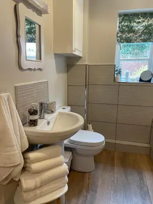 a bathroom with a sink and a toilet at Vicarage Court detached bungalow in Oswestry