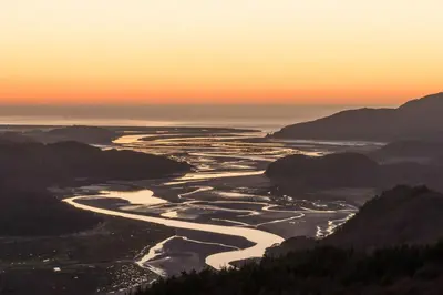 an aerial view of a river at sunset at Ysgubor-Bennar in Dyffryn