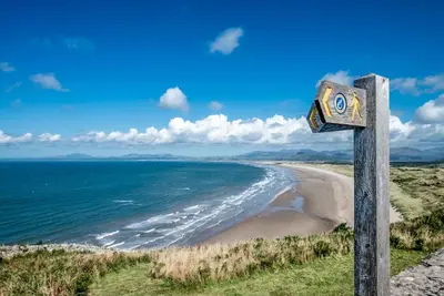 a sign on the side of a beach at Isgoed in Talsarnau