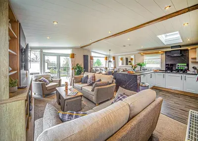 a large living room with couches and a kitchen at Beautiful Home In Bala, Gwynedd W in Llanfor