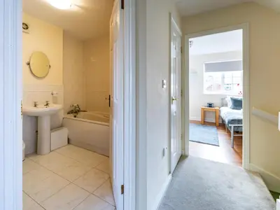 a bathroom with a tub and a sink and a toilet at Pass the Keys 3 Bedroom home local to Ludlow town centre in Ludlow