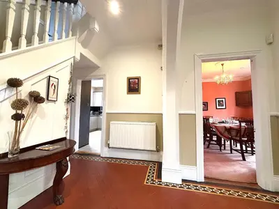 a living room with a table and a dining room at Spacious 4-Bed Home - Oswestry - Families & Groups in Oswestry