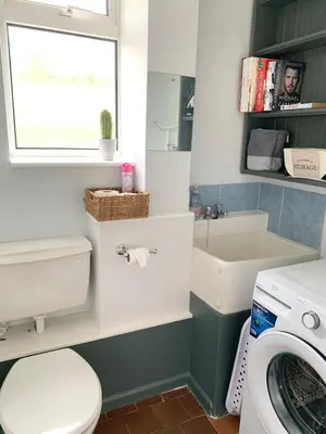 a bathroom with a toilet and a sink at Ty Newydd in Llangyniew