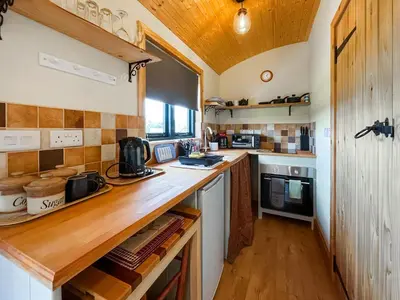 a kitchen with a wooden counter top in a room at Blodwen - Ukc7016 in Corwen